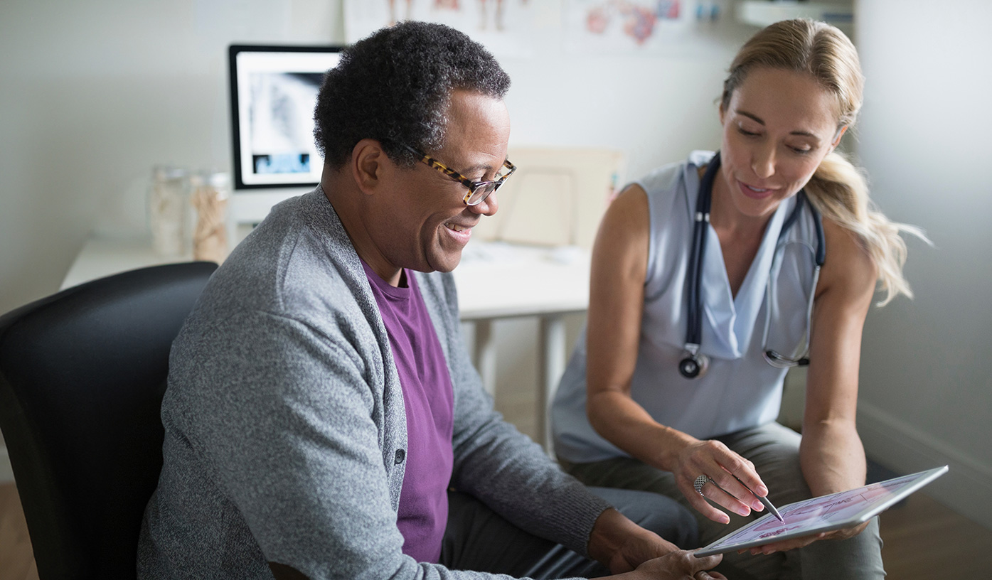 Physician sharing information with patient about psoriatic disease